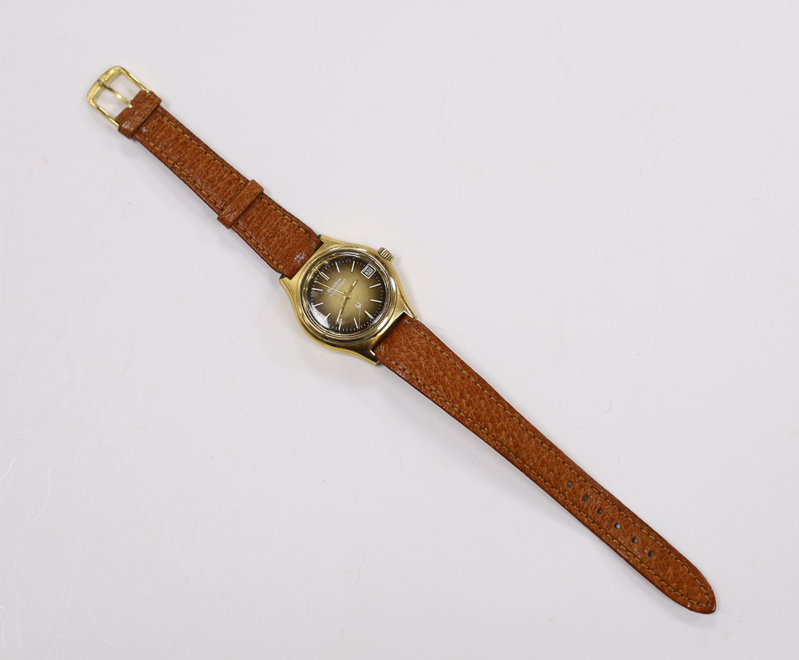 A lady's steel and gold plated Bulova Accutron wrist watch, on a leather strap.